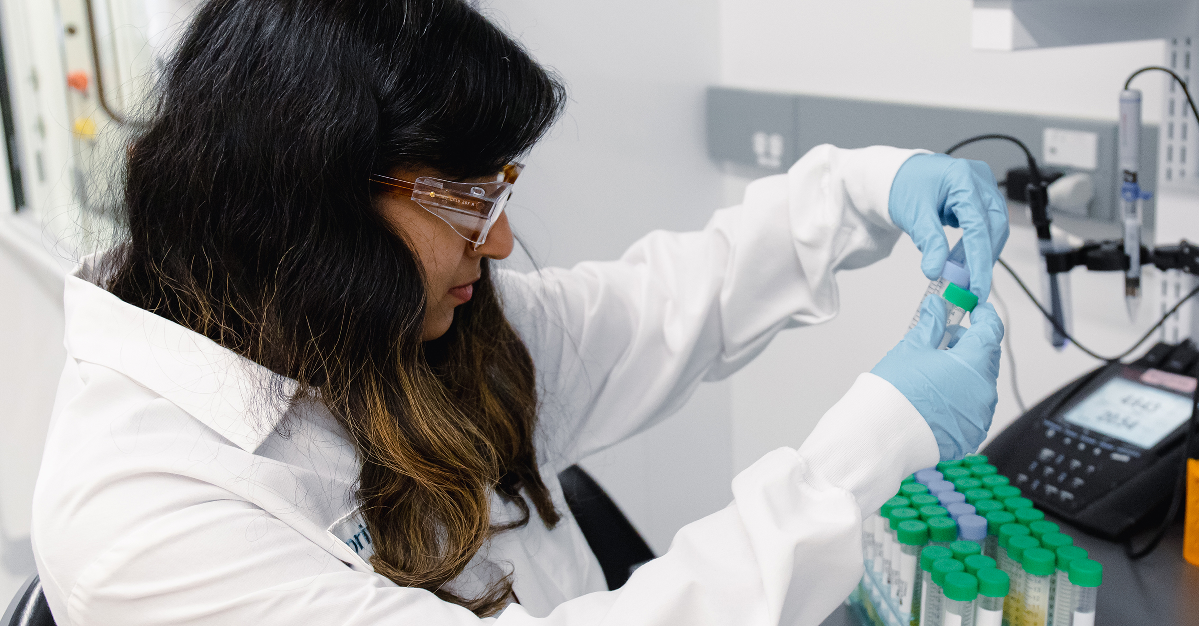 Supriya Karekar, Fermentation Manager with test tubes.